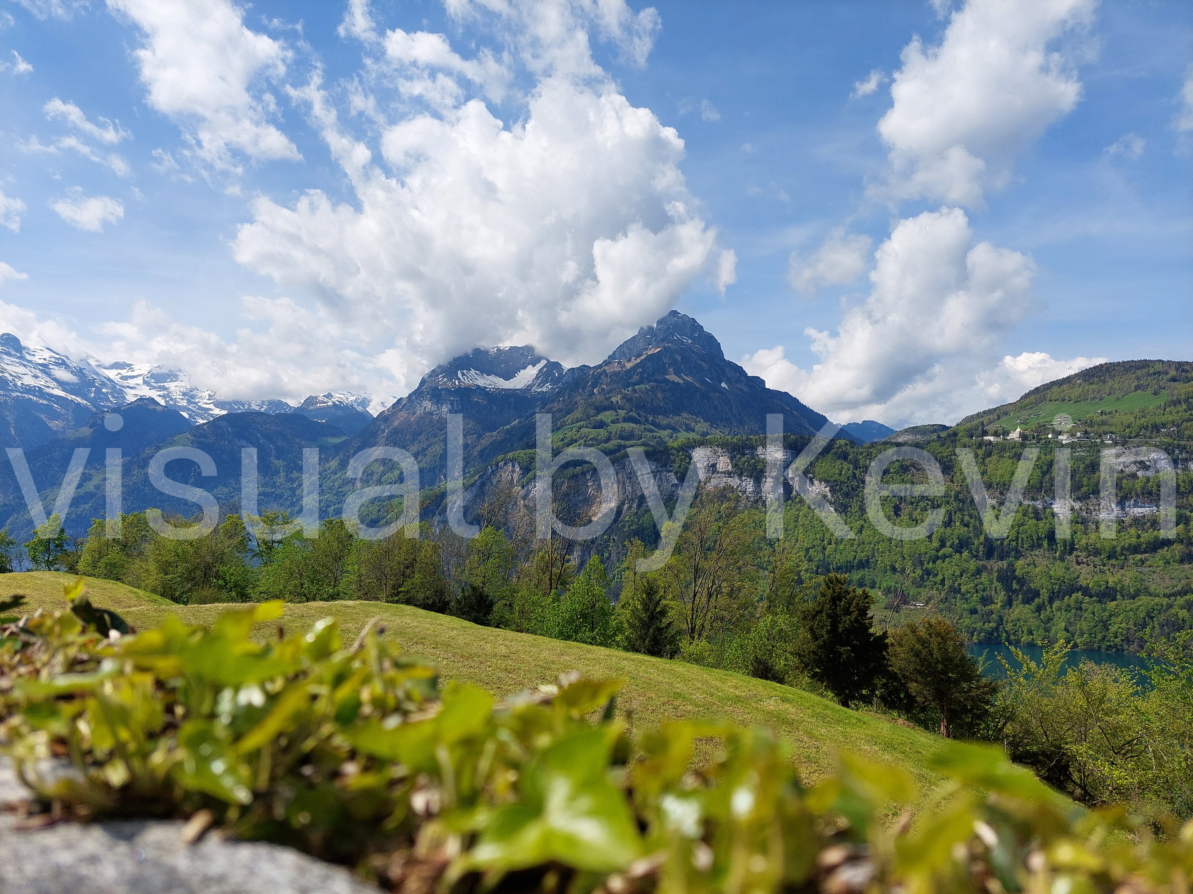 Green hills before a rock massif