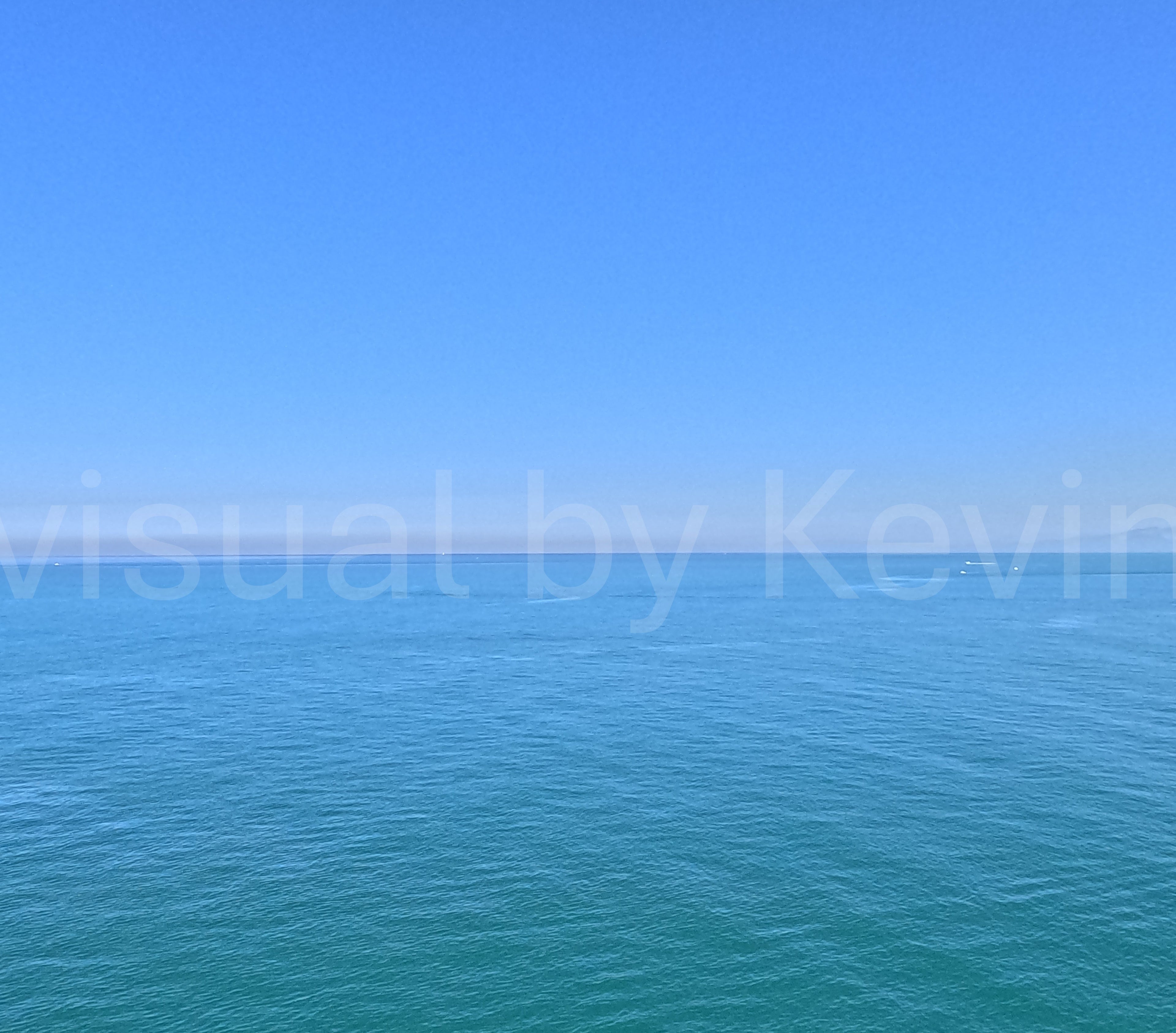 Vastness of the sea under a blue sky