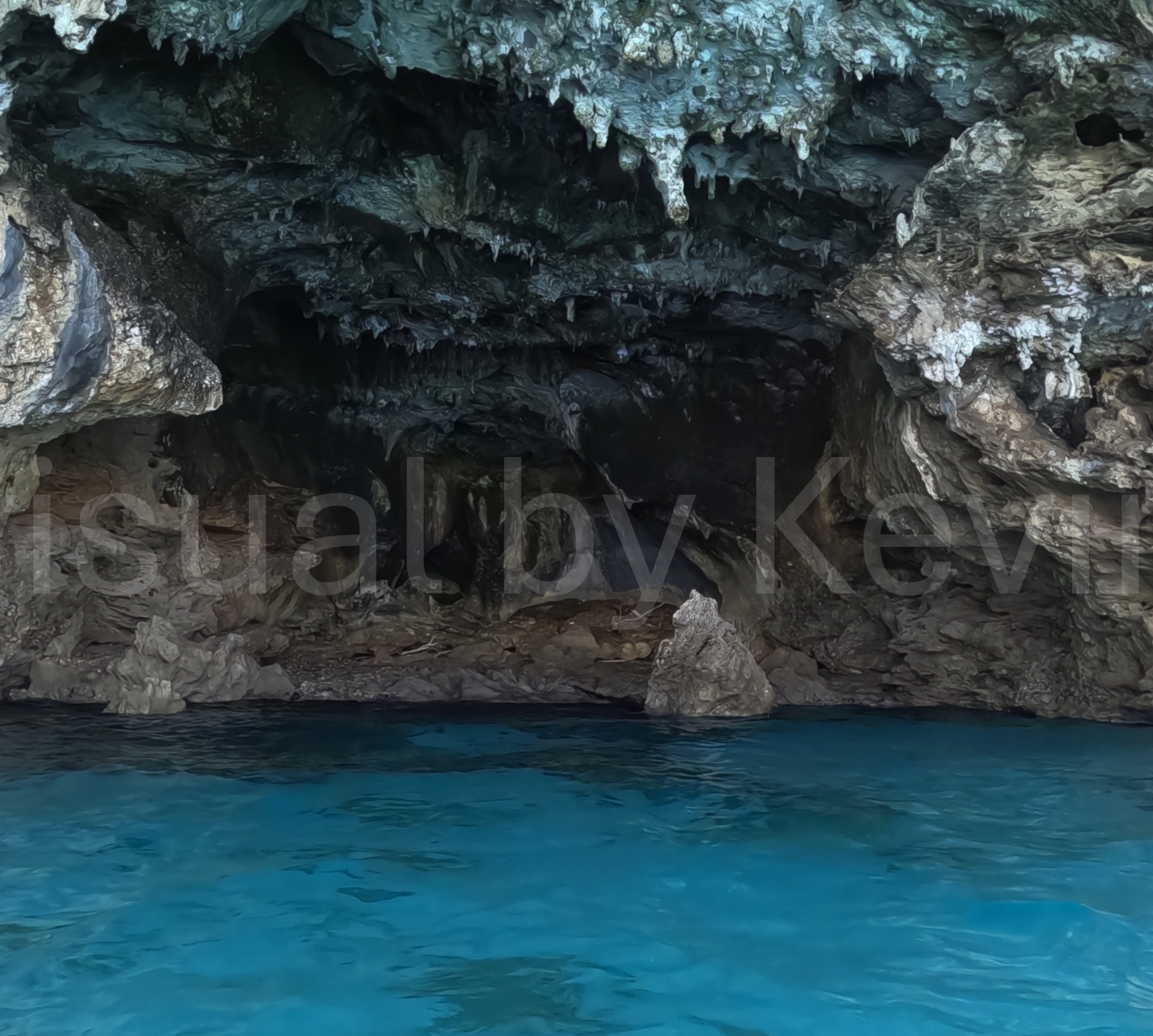 Sea cave with stalactite formations