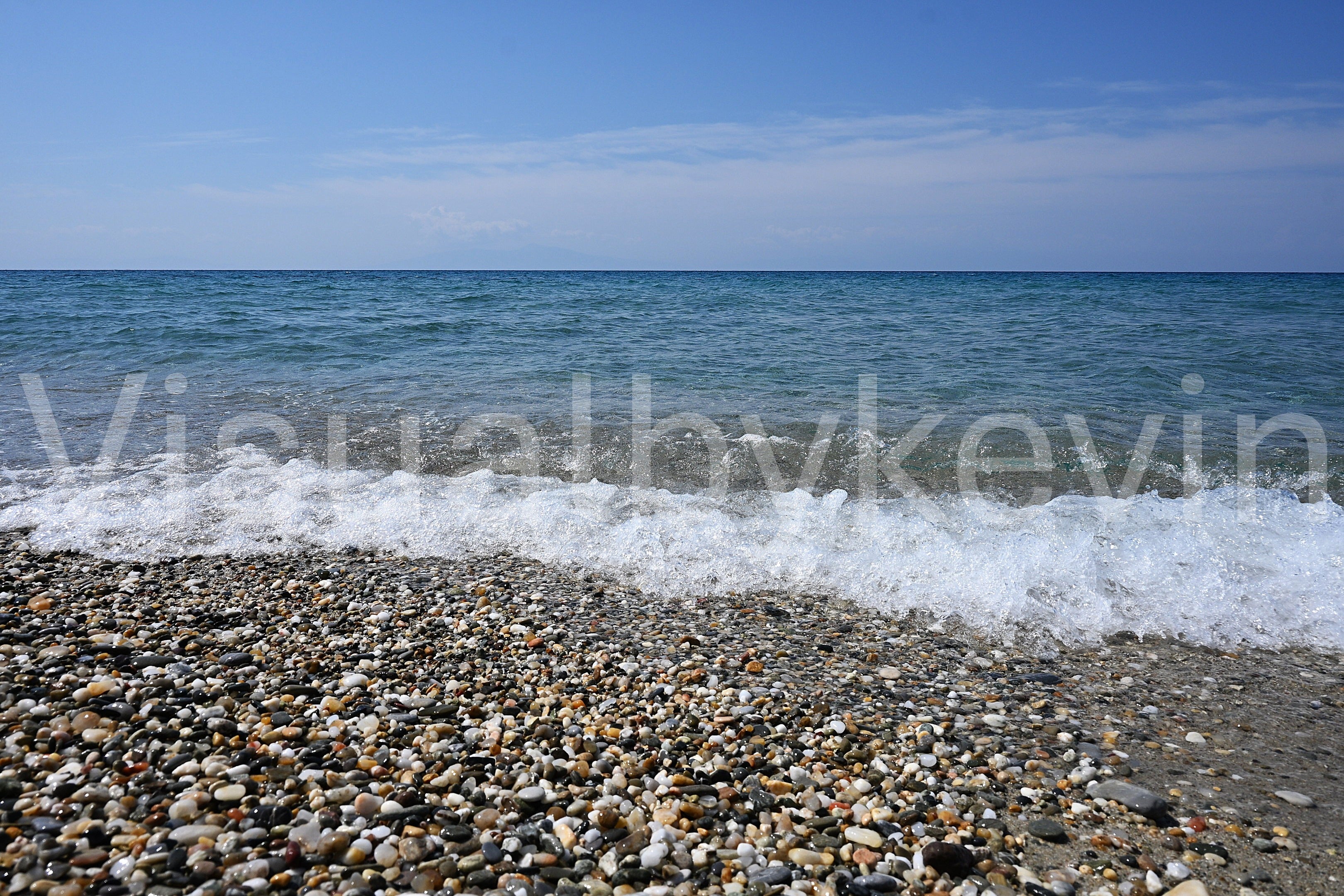 Shingle bank with breaking wave